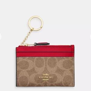 NWT Coach! Mini Skinny Id Case
In Signature Canvas 🌹